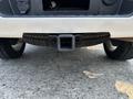 A 2017 Chevrolet Silverado 1500 with a hitch receiver mounted on its rear bumper