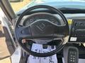 Steering wheel and dashboard of a 2013 International 7500 displaying gauges and control buttons