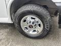 Close-up of a chrome wheel with multi-spoke design mounted on a tire featuring the Goodyear brand and rugged tread pattern