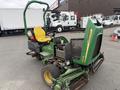 A 2009 John Deere 2653B Precision mower with a yellow seat and green body designed for maintaining golf course lawns and sports fields