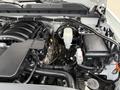 The image shows the engine compartment of a 2018 Chevrolet Silverado 1500 with various components including the engine block and wiring harness