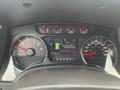 Dashboard of a 2014 Ford F-150 displaying gauges for fuel economy and speed along with warning lights and gear selector labeled P R N D M 2 1