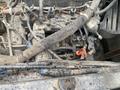 A 2010 Kubota RTV 900 engine with exposed wiring and hoses showing dirt and grime on the components