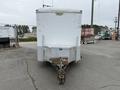 A 2016 Continental cargo trailer with a white exterior and a silver metal hitch in the front