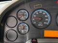 Dashboard gauges of a 2011 International 4300 displaying water temperature oil pressure and engine RPM readings
