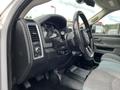 Interior view of a 2015 RAM 2500 showing the dashboard steering wheel and control panel with textured seat upholstery