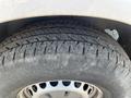Close-up of a tire on a 2016 Mercedes-Benz Sprinter showing detailed tread patterns and metal rim