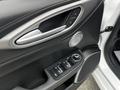Interior door panel of a 2023 Alfa Romeo Giulia featuring window controls door handle speaker grille and a control knob for adjustments