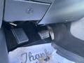 Interior view of a 2017 RAM 1500 showing the accelerator and brake pedals along with a floor mat that has the word Thank printed on it