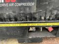 A 2012 Workhorse W62 with a visible label stating "COMPRESSOR TRAY MUST BE OUT BEFORE STARTING" along with electrical connections in red and black