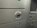 Close-up of a cargo box lamp switch on a 2022 International MV607 with a red indicator light and labeled switch for on and off functionality