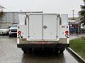 A 2015 Ford F-450 with a white rear and double doors is parked with red taillights visible