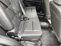 Interior view of a 2019 Ford Explorer showing black leather rear seats with seat belts attached