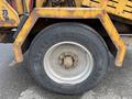 Close-up view of the tire of a 2015 Vermeer Corporation BC1200XL with visible wear and a rusty metallic rim