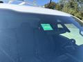 A 2019 Ford F-150 with a green inspection sticker displayed on the windshield