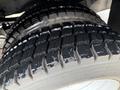 Close-up of the tire tread on a 2020 Ford F-550 showcasing deep grooves and wear patterns on the rubber surface