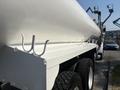 A 2008 Peterbilt 340 truck with a large white tanker body featuring several hooks along the side and heavy-duty tires