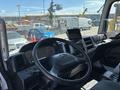 Interior view of a 2020 Hino 338 featuring a steering wheel dashboard and control panel with gauges and a screen