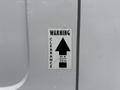 A warning sign indicating a clearance height of 10 feet or 3.5 meters with an upward arrow