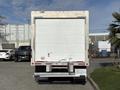 A 2023 Ford E-450 box truck viewed from the rear with a white cargo area and a step bumper at the bottom