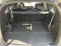 The image shows the interior cargo area of a 2017 Kia Sorento with rubber floor mats and a foldable rear seat arrangement