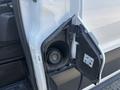 A close-up view of the fuel filler door on a 2019 Ford Transit 350 with the cap removed displaying fuel instructions