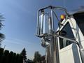 A 2008 Peterbilt 340 truck featuring a chrome side mirror and stainless steel accents on the driver's side