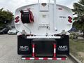 A 2025 Peterbilt 536 truck with a large tank labeled 2000 GALS and a hose reel on the back showcasing the AMG logo
