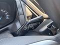 Close-up of a 2019 Ford Transit 350 control lever featuring buttons for windshield wipers indicators and light controls