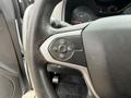 Steering wheel controls of a 2017 Chevrolet Colorado displaying buttons for cruise control settings