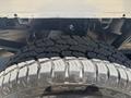 Close-up of a rugged tire from a 2019 Ford F-150 showcasing deep treads and robust construction designed for off-road performance