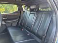 Interior view of the backseat of a 2023 Fisker Ocean featuring leather seating four seatbelts and headrests