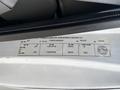 2008 Ford Econoline van with a label detailing specifications and manufacturing information