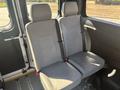 Two gray upholstered seats with adjustable headrests positioned in the interior of a 2020 RAM ProMaster 3500 vehicle