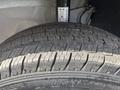 Close-up of a tire from a 2023 RAM Promaster 3500 showcasing tread patterns and wear on the rubber surface
