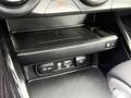 Interior console of a 2021 Kia Forte featuring a wireless charging pad 12V outlet USB port and auxiliary input socket