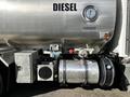 A 2013 Kenworth T370 with a silver fuel tank labeled DIESEL featuring various gauges and mechanical components