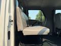 A gray upholstered seat in a 2006 Sterling Acterra truck's cabin with a safety belt and metal frame