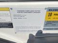 A compliance notice label for a 2013 Larson 238 boat detailing manufacturer information and model specifics