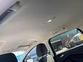 Interior view of a 2016 Ford Escape showing the ceiling overhead light and part of the front seats