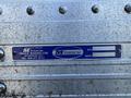 A metal identification plate displaying the manufacturer name Minoru Truck Bodies Ltd with serial number 1432 and date 11 17 12