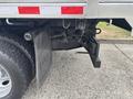 2014 Ford F-550 truck with visible rear suspension parts and a hitch attachment displaying the vehicle's mechanical features and capabilities