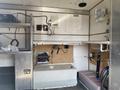 A 2008 Wells Industries Inc EW1422 with a countertop area featuring plumbing connections and a control panel mounted on the wall