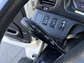 Close-up of the turn signal lever in a 2015 Hino 358 featuring controls for headlights and passing lights