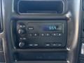 Dashboard of a 2007 GMC C4500 TopKick showing a digital clock display and control buttons for AM FM audio settings