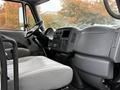 Interior view of a 2006 International 4200 showing the dashboard steering wheel and driver's seat