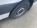 A flat tire on a 2022 Mercedes-Benz Sprinter showing the wheel and tire details