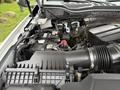The engine compartment of a 2020 Ford F-550 showing the air intake system battery and various engine components