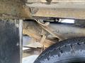 Close-up of the undercarriage of a 2015 Ford F-550 showing components like the suspension system and part of the wheel assembly