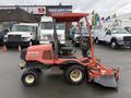 A 2015 Kubota F3990 lawn mower with a red body and a front-mounted mowing deck, featuring a driver's seat and steering wheel